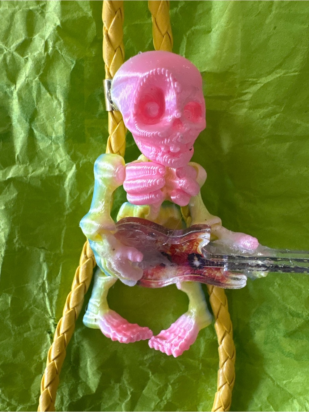 Neon Pink And Yellow Skeleton Playing Guitar Bolo Tie